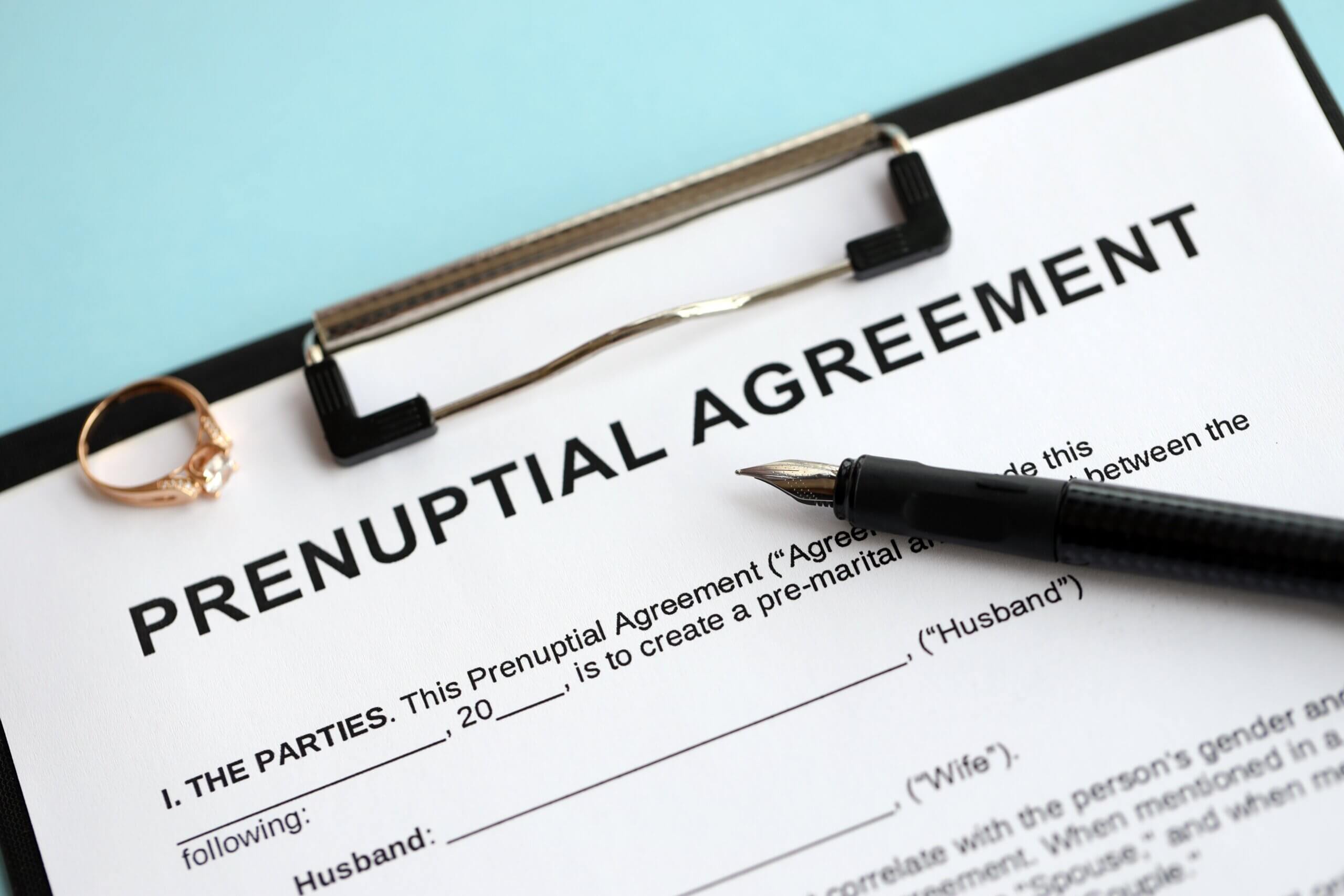 Prenuptial,Agreement,And,Wedding,Ring,On,Table.,Premarital,Paperwork,Process